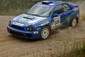 Heath Nunnemacher / Kim DeMotte through a left-hand sweeper on SS10 in their Subaru WRX.