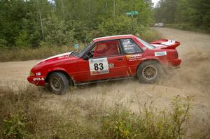 Mark Utecht / Rob Bohn drift their Ford Mustang through a sweeper on SS10.