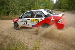 Jan Zedril / Jody Zedril kick up plumes of silt at a left-hander on SS12 in their Mitsubishi Lancer ES.