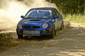 The George Georgakopoulos / Faruq Mays Subaru WRX through a 90 degree right-hander on SS12.