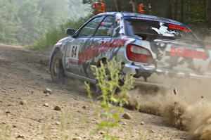 Robert Borowicz / Dave Parps accelerate through an uphill right-hander on SS12 in their Subaru WRX.