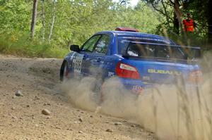 Slawomir Balda / Janusz Topor sling gravel through an uphill right-hander on SS12 in their Subaru WRX STi.