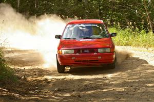 Gerardo Pin / John Butler through a 90-right on SS12 in their Ford Escort GT.