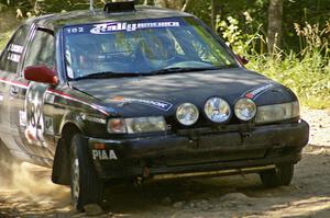 Silvio Alva / Ben Slocum through an uphill right-hander on SS12 in their Nissan Sentra SE-R.