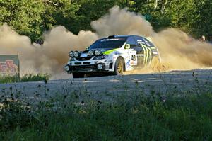 Ken Block / Alex Gelsomino sling gravel at the spectator point on SS13 in their Subaru WRX STi.