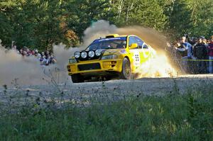 The Subaru Impreza of Kyle Sarasin / Mikael Johansson slings gravel as it accelerates away from the SS13 spectator point.