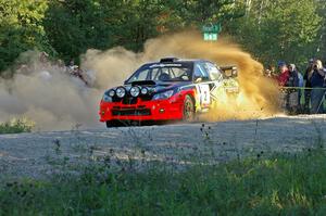 Andy Pinker / Robbie Durant sling gravel at the spectator point on SS13 in their Subaru WRX STi.