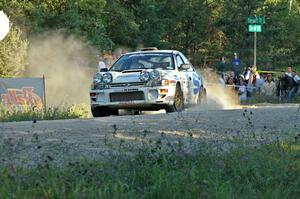 Henry Krolikowski / Cindy Krolikowski blast away from the spectator point on SS13 in their Subaru Impreza.