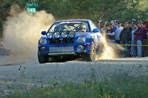 George Georgakopoulos / Faruq Mays blast away from the spectator point on SS13 in their Subaru WRX.