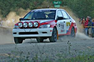 Jan Zedril / Jody Zedril accelerate from the spectator location on SS13 in their Mitsubishi Lancer ES.