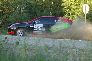 Roman Pakos / Maciej Sawicki exit onto the county road at the spectator point on SS13 in their Ford Focus SVT.