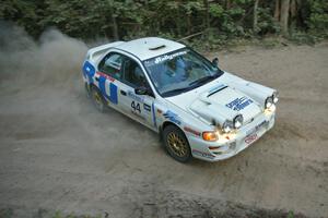 Henry Krolikowski / Cindy Krolikowski drift their Subaru Impreza through a right-hander on SS15.