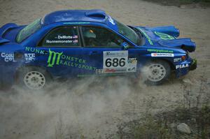 Heath Nunnemacher / Kim DeMotte drift through a right-hander on SS15 in their Subaru WRX.