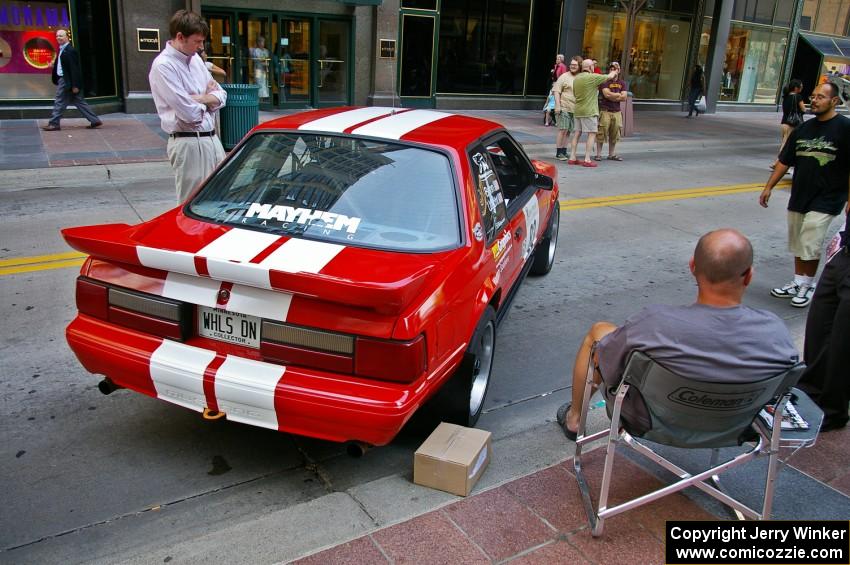 Mark Utecht relaxes next to the Ford Mustang he and Rob Bohn shared (2).