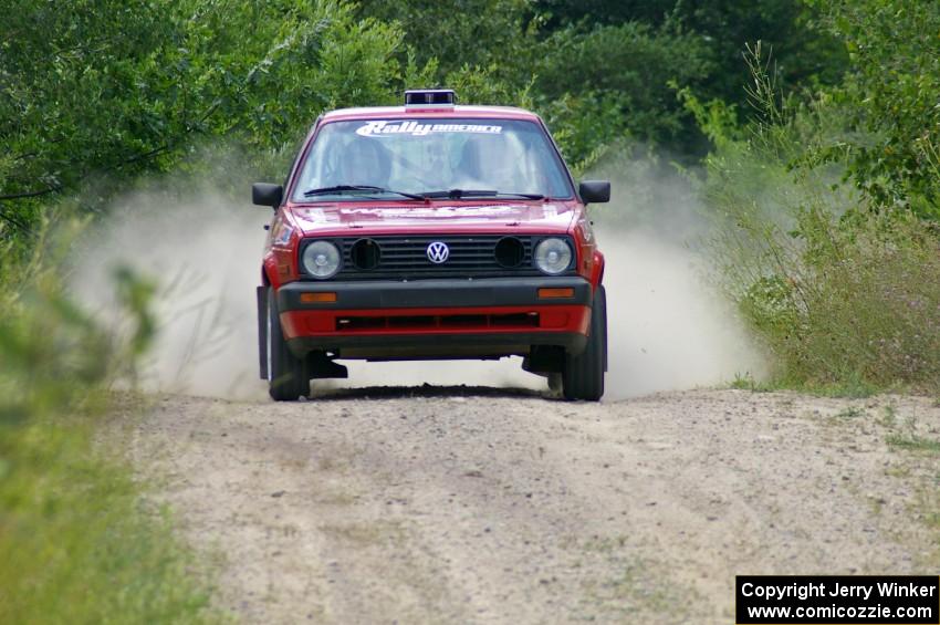 Daryn Chernick / Joe Czubaty come flying over a crest on the practice stage in their VW GTI.