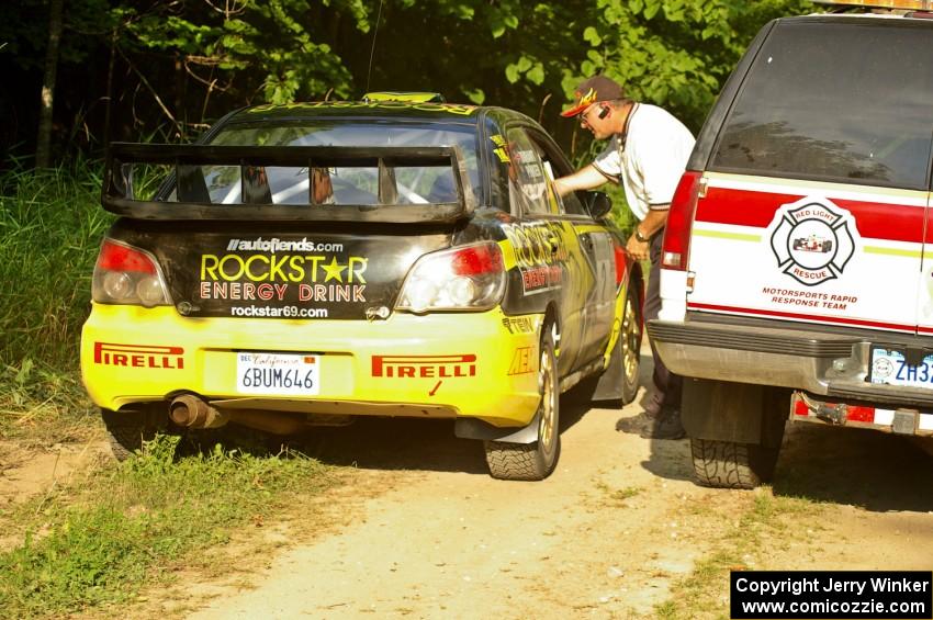 The Andy Pinker / Robbie Durant Subaru WRX STi checks in with Paul Ahles at the start of the practice stage.