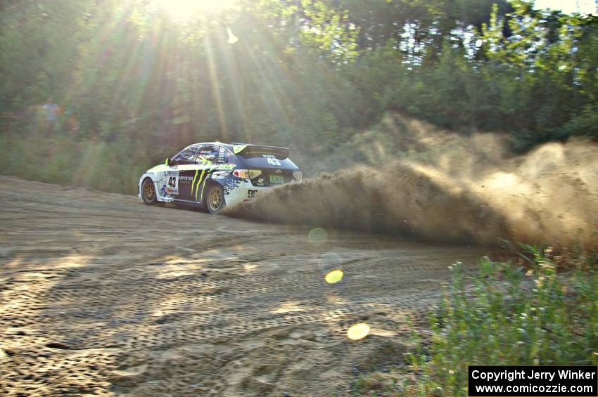 Ken Block / Alex Gelsomino fly through a fast right-hander on SS2 in their Subaru WRX STi.