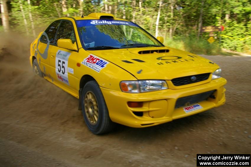 Kyle Sarasin / Mikael Johansson drift their Subaru Impreza through a right-hander on SS2.