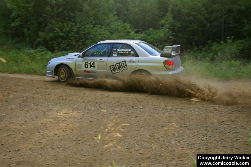 Piotr Wiktorczyk / Chrissie Beavis at speed through a right-hander on SS2 in their Subaru WRX STi.