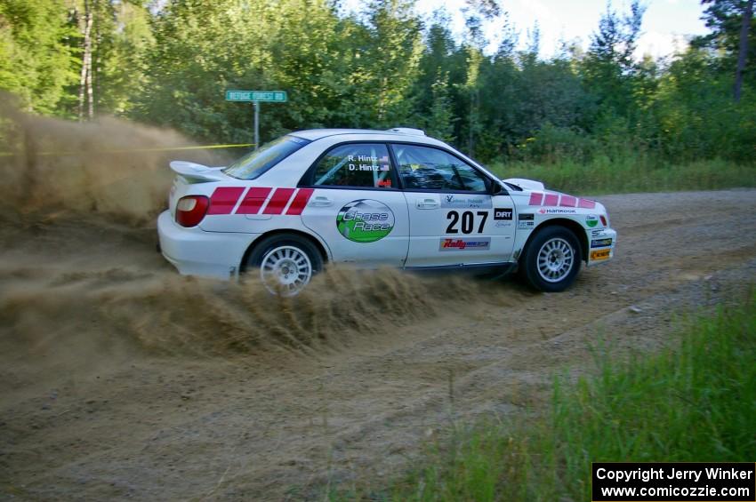 Dave Hintz / Rick Hintz throw up a huge plume of gravel on SS2 in their Subaru WRX.