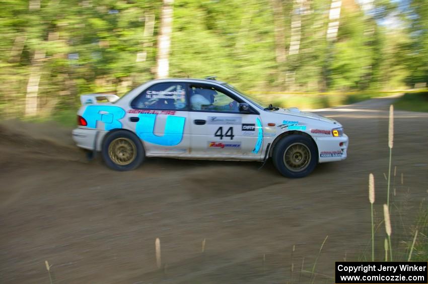 Henry Krolikowski / Cindy Krolikowski drift through a 90-right on SS2 in their Subaru Impreza.