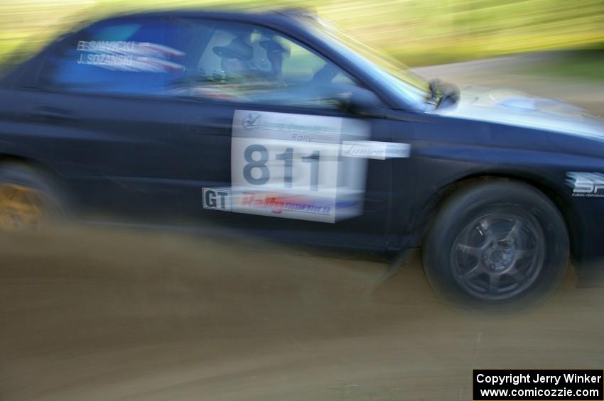 Jaroslaw Sozanski / Bartosz Sawicki sling gravel at a hard-right hander on SS2 in their Subaru WRX.