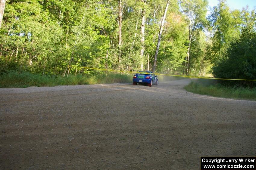 Heath Nunnemacher / Kim DeMotte overshoot the corner at a right-hander on SS2 in their Subaru WRX.