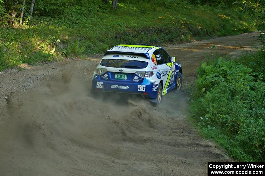 Travis Pastrana / Derek Ringer drift beautifully through a right-hander on SS3 in their Subaru WRX STi.