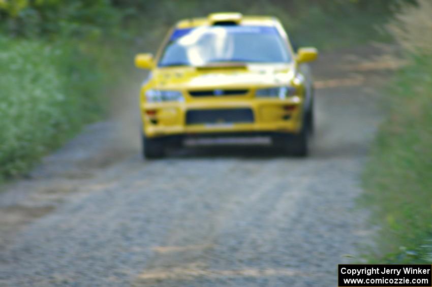 Kyle Sarasin / Mikael Johansson at speed down a straight in their Subaru Impreza on SS3.