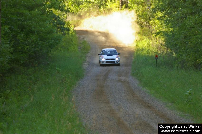 Dave Hintz / Rick Hintz at speed down a fast straight on SS3 in their Subaru WRX.