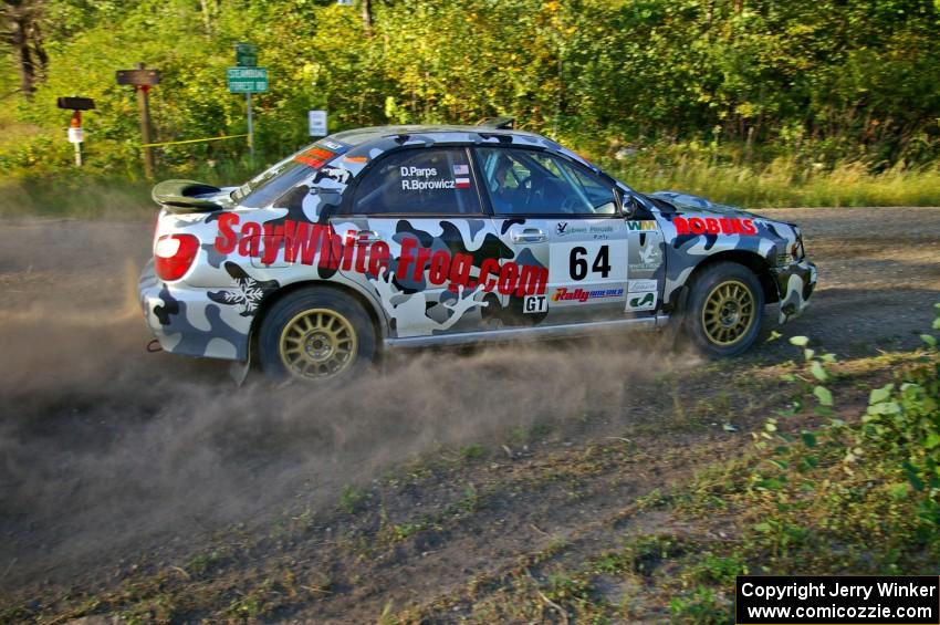 Robert Borowicz / Dave Parps drift through a right-hander on SS3 in their Subaru WRX.