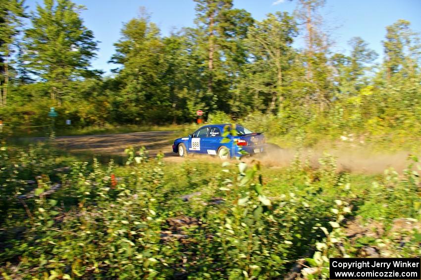 The George Georgakopoulos / Faruq Mays Subaru WRX prepares for a sharp right-hander on SS3.