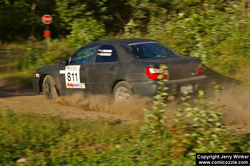 Jaroslaw Sozanski / Bartosz Sawicki set up for a hard right on SS3 in their Subaru WRX.