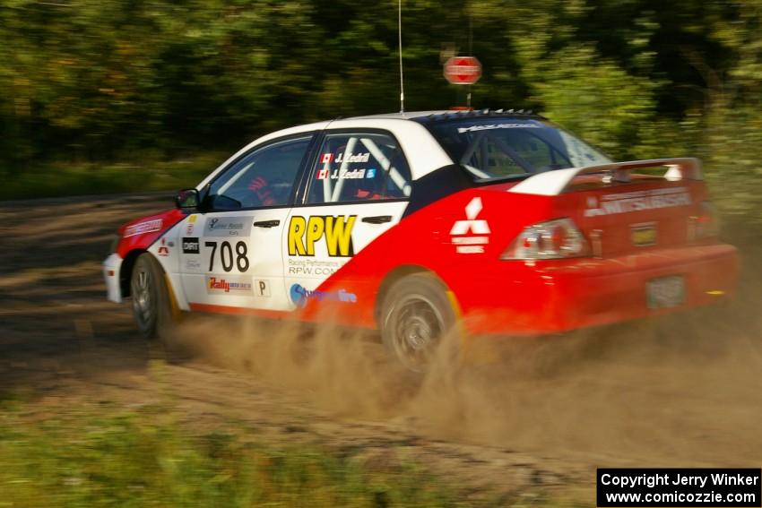 Jan Zedril / Jody Zedril prepare for a hard right-hander on SS3 in their Mitsubishi Lancer ES.