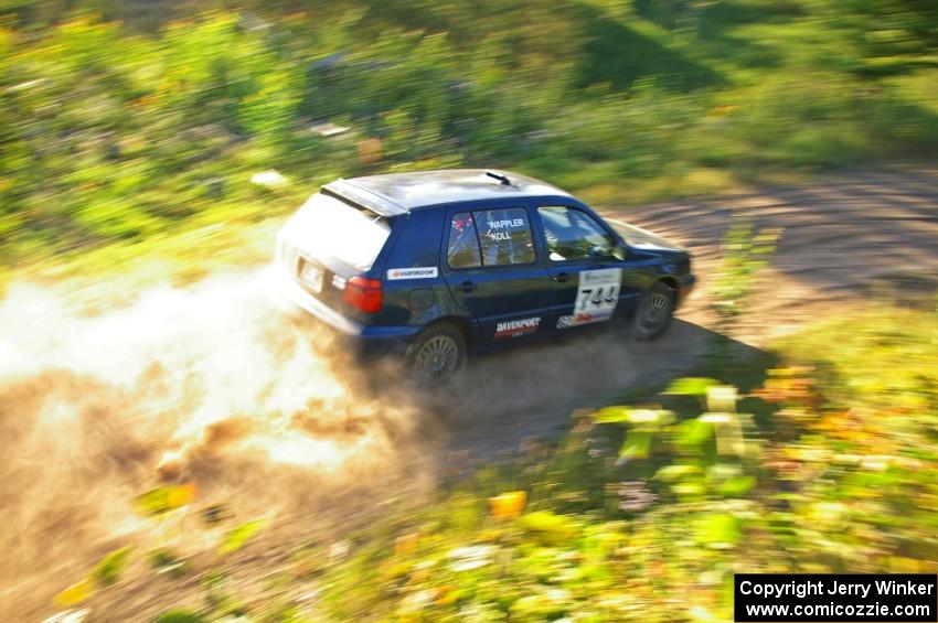 Paul Koll / Matt Wappler rocket down a straight on SS3 in their VW Golf.