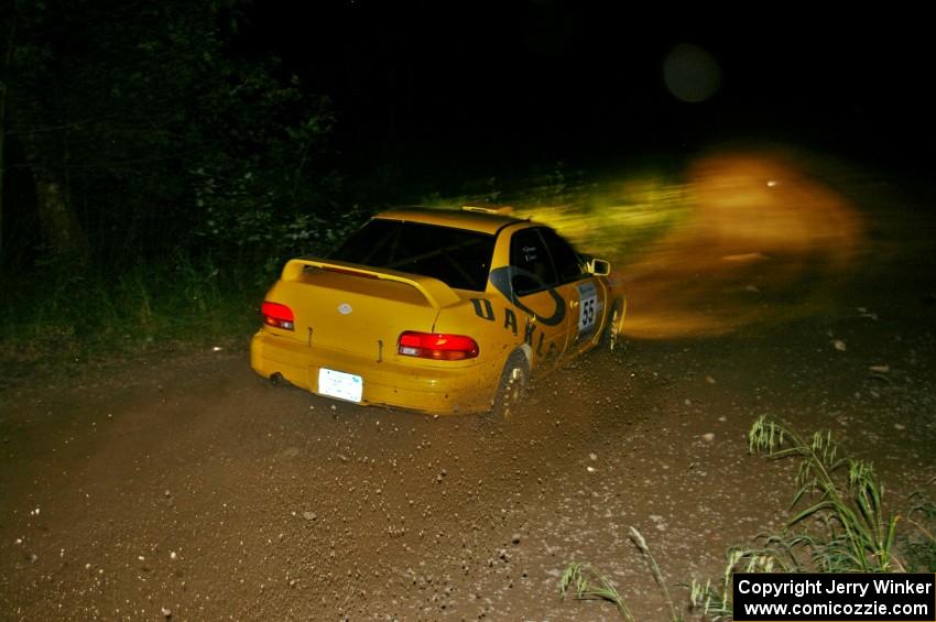 Kyle Sarasin / Mikael Johansson drift their Subaru Impreza through a quick left-hander on SS5.