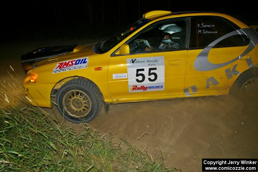 Kyle Sarasin / Mikael Johansson drift their Subaru Impreza through a left-hander on SS6.