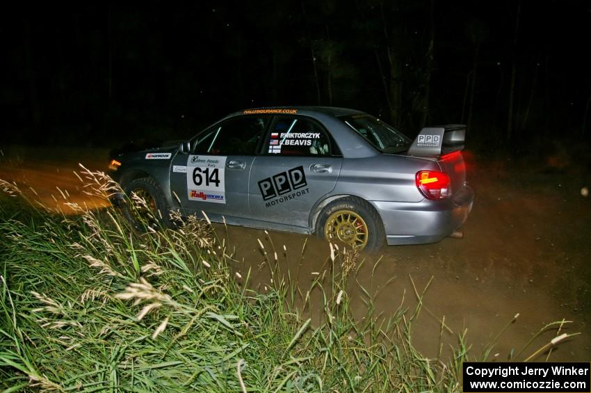 Piotr Wiktorczyk / Chrissie Beavis come out of a 90-left on SS6 in their Subaru WRX STi.