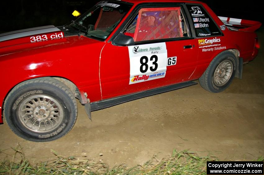 Mark Utecht / Rob Bohn drift their Ford Mustang through a sweeper on SS6.