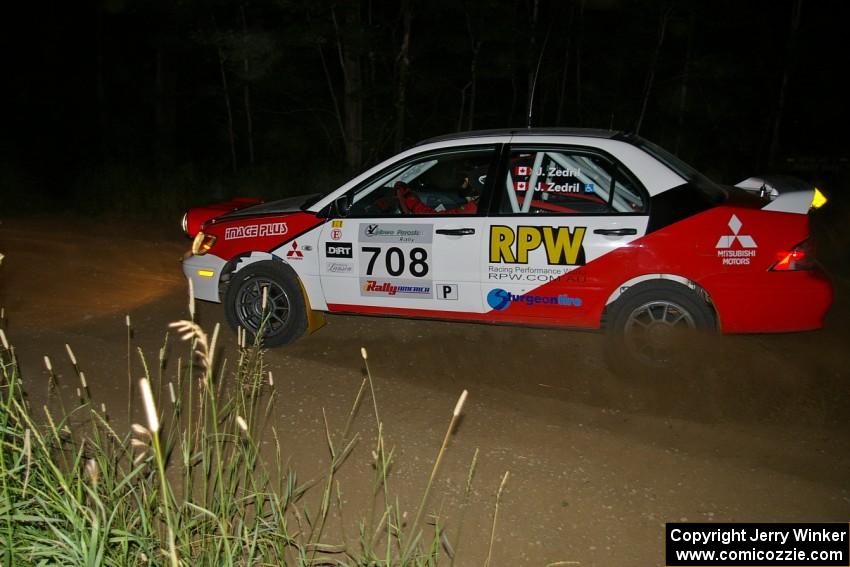 Jan Zedril / Jody Zedril exit out of a left-hander on SS6 in their Mitsubishi Lancer ES.