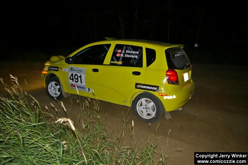 Jim Stevens / Marianne Stevens in their Suzuki Swift come out of a left-hander on SS6.