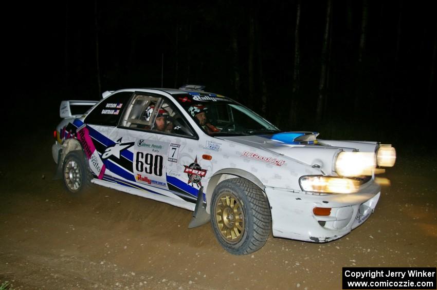 Kenny Bartram / Dennis Hotson prepare for a right-hand hairpin on SS8 in their Subaru Impreza.