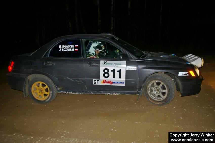 Jaroslaw Sozanski / Bartosz Sawicki drift wide out of a hairpin on SS8 in their Subaru WRX.