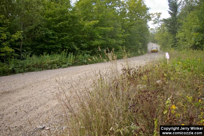 The Kyle Sarasin / Mikael Johansson Subaru Impreza rockets down a fast straight prior to a fast left-hander on SS10.