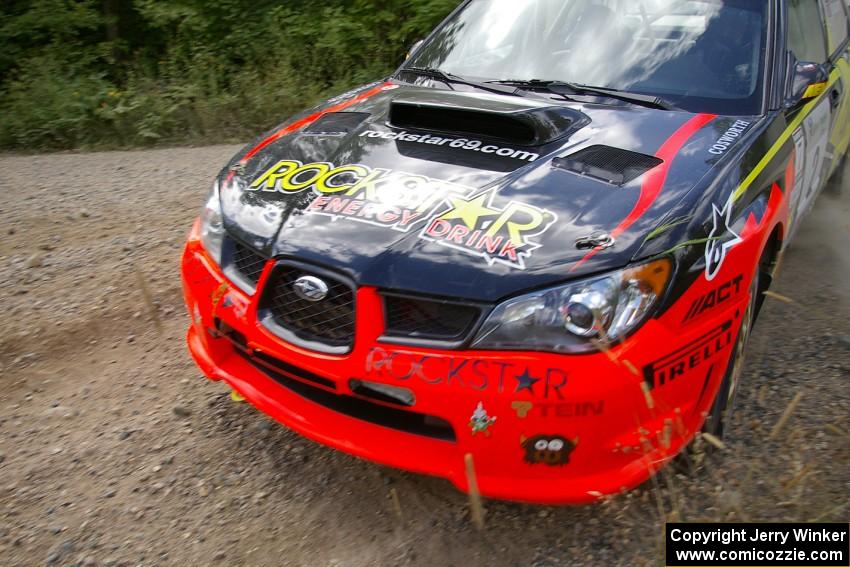 Andy Pinker / Robbie Durant at speed through a left sweeper on SS10 in their Subaru WRX STi.