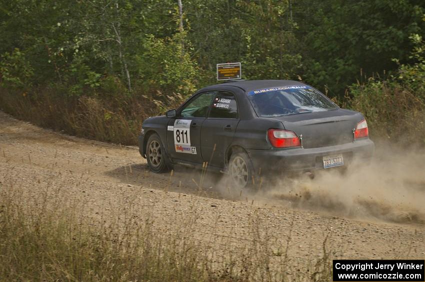 Jaroslaw Sozanski / Bartosz Sawicki exit out of a fast left-hander on SS10 in their Subaru WRX.