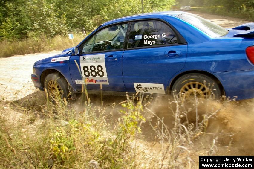 The George Georgakopoulos / Faruq Mays Subaru WRX at speed through a fast left-sweeper on SS10.