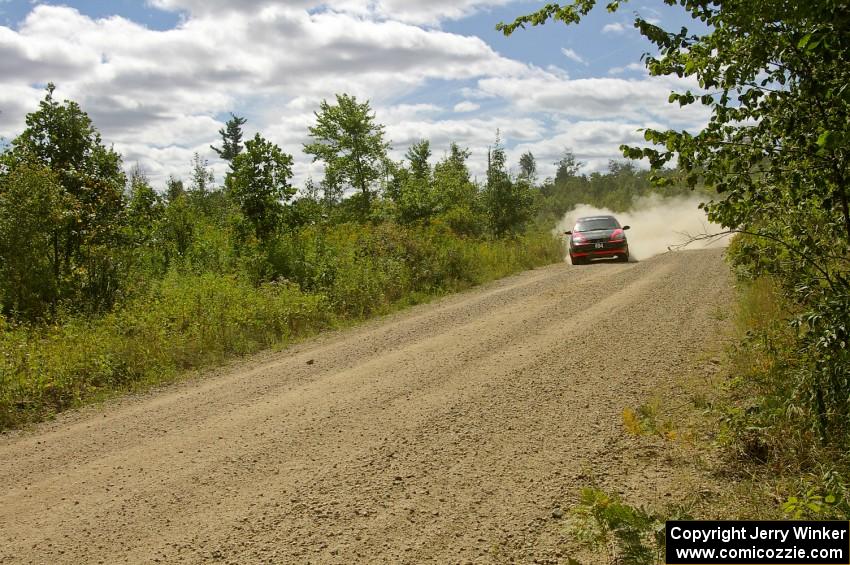 Roman Pakos / Maciej Sawicki exit out of a fast left-hander on SS10 in their Ford Focus SVT.