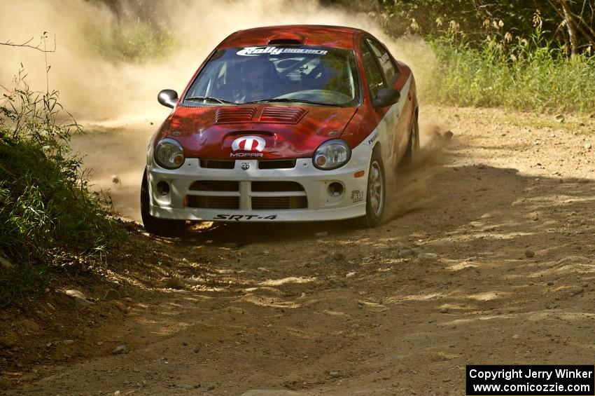 Doug Shepherd / Karen Wagner beautifully apex an uphill 90-right on SS12 in their Dodge SRT-4.