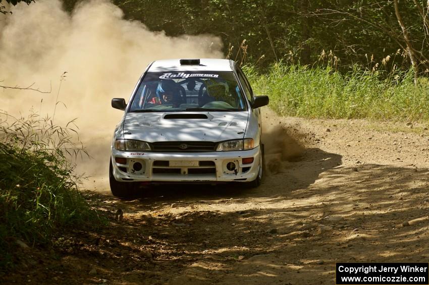 The Bob Olson / Conrad Ketelsen Subaru Impreza 2.5 RS blasts through an uphill 90-right on SS12.